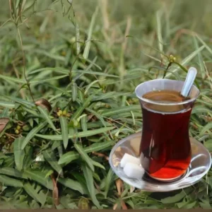 Premium Indian Sarsaparilla root powder from Sri Lanka in traditional packaging on wooden surface
